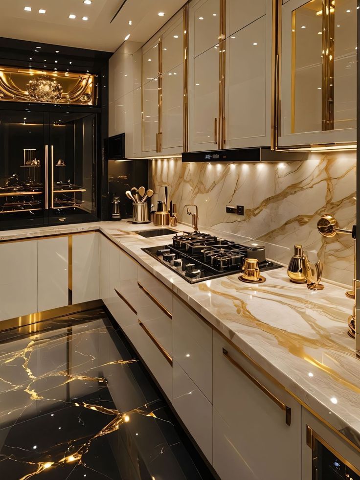 White kitchen with gold-veined marble and brass fittings